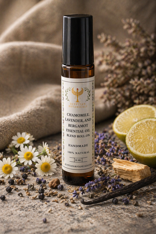 Essential oil roll-on bottle with chamomile, lavender, and bergamot on a rustic background with herbs and lemons.