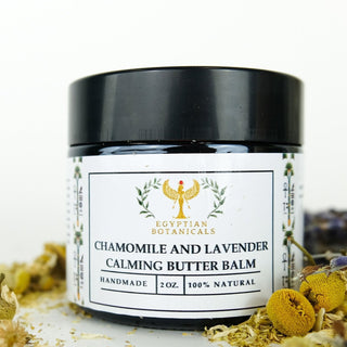 Chamomile and Lavender Calming Butter Balm with dried Chamomile in the background



