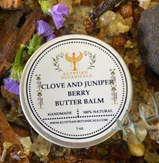 Butter balm labeled 'Clove and Juniper Berry' surrounded by natural ingredients.