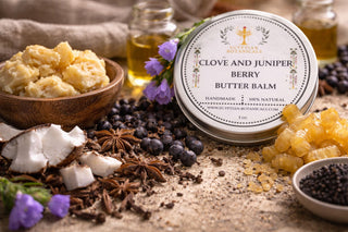 Clove and Juniper Berry Butter Balm with natural ingredients on a rustic background