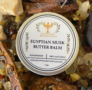 Egyptian Musk Butter Balm container with botanicals around it