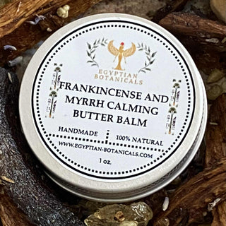 Tin of Frankincense and Myrrh Calming Butter Balm by Egyptian Botanicals on a natural background.