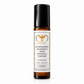 A 10 ml roll-on bottle of Egyptian Botanicals Juniper Berry Grapefruit Musk Botanical Perfume, featuring an amber glass bottle, a black cap, and a white label with gold and black text.