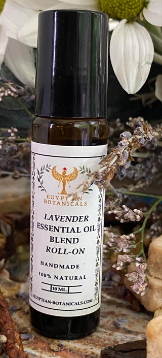 Lavender essential oil blend roll-on bottle with botanicals in the background