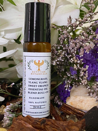 Lemongrass, Ylang Ylang and Sweet Orange Natural Botanical Perfume
bottle with flowers and herbs in the background