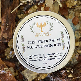 Tin of Egyptian Botanicals Like Tiger Balm Muscle Pain Rub surrounded by natural ingredients.