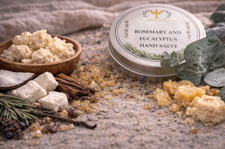 Rosemary and Eucalyptus Hand Salve with natural ingredients on a textured surface