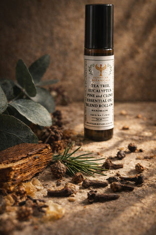 Tea Tree, Eucalyptus, Pine and Clove Essential Oil Blend Essential oil roll-on bottle with natural elements on a rustic surface