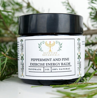 Peppermint and Pine Exercise Energy Butter Balm with pine tree needles in the background

