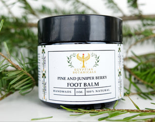pine and juniper berry balm with pine needles in the background
